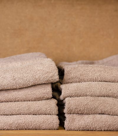 brown-towels-sitting-shelf